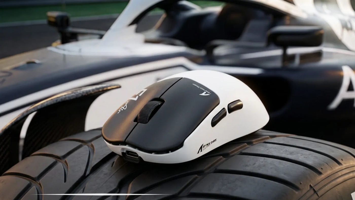 Black and white gaming mouse placed on a race car tire